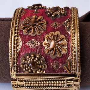 Ruby red and gold hinged bracelet.